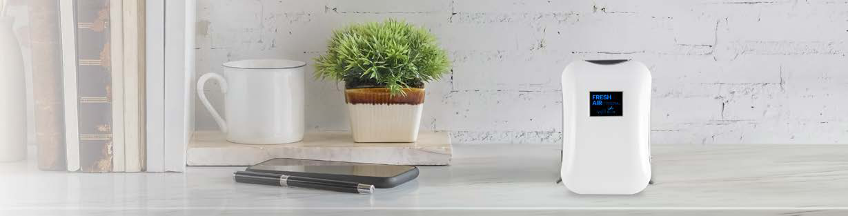 Original FreshAir Personal manufacturer photograph showing the white personal device on a desk